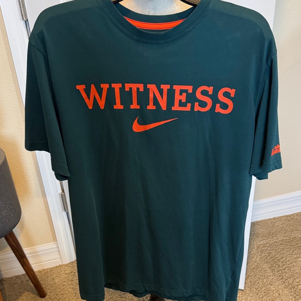Nike Men's Dark Green Tee with Bold Orange Logo Witness